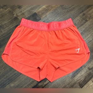 GymShark- Womens Training Loose Fit Shorts. Color: Pepper Red. Size: Medium